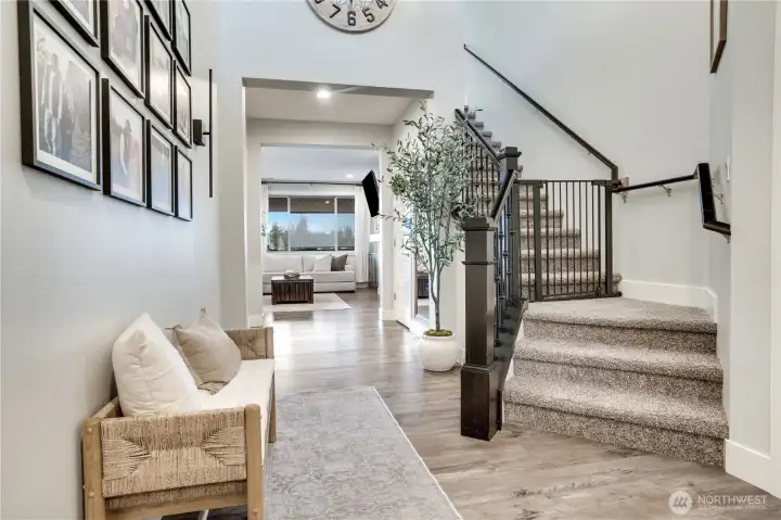 Head upstairs where it features a private primary retreat, versatile landing, three additional bedrooms, full bath, and convenient laundry