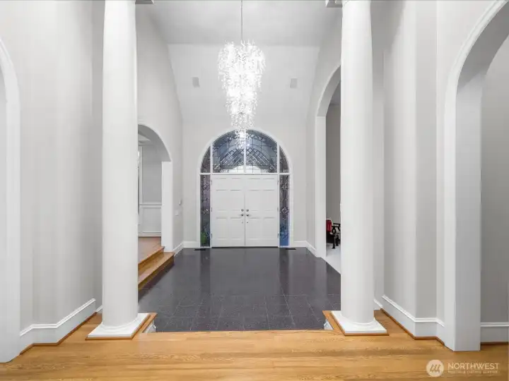 Dramatic Foyer with vaulted ceiling, extravagant (& new) chandelier, and freshly painted.