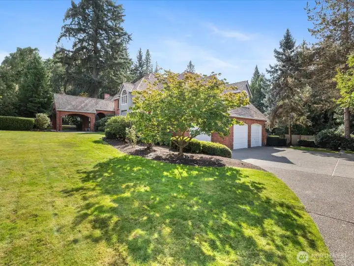 Back driveway leads to 3 car deluxe garage.