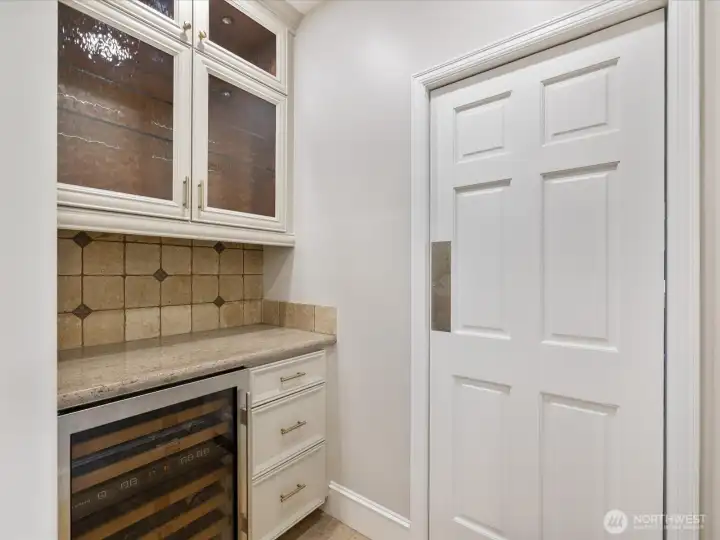 Butler's pantry is in between the kitchen and formal dining room.
