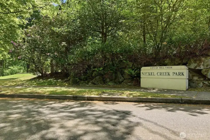 Nickel Creek Park, offers a peaceful natural setting with a nature trail, open grass play area, picnic tables, playground, swings, basketball hoop, and geocache—making it a wonderful place to walk, play, picnic, and enjoy the outdoors.