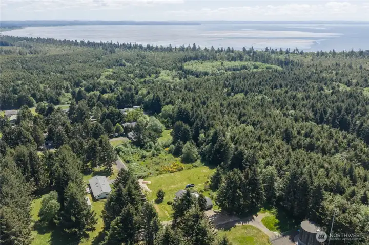 Enjoy nature in this lot nestled near the forest and close to the bay.