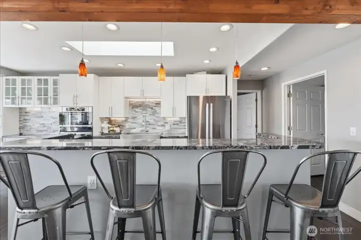Fully updated kitchen with bar seating, gorgeous tilework