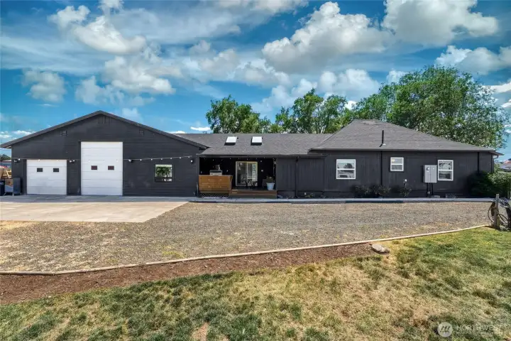 Exterior side view of 248 Hanson featuring outdoor kitchen and shop doors