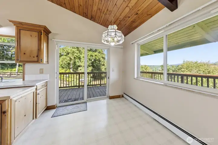 Dining or breakfast area with another sliding door to the expansive deck