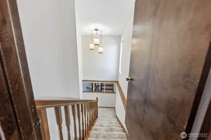 Stairs leading to lower living areas and bedrooms