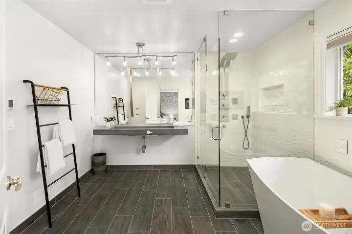 Primary ensuite bathroom includes large glass shower, a stand-alone soaking tub, and TOTO smart toilet Primary ensuite bathroom includes large glass shower, a stand-alone soaking tub, and TOTO smart toilet
