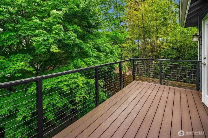 French doors lead to this private deck off the primary. Lush trees and greenery create your own sanctuary for your morning coffee - or your evening cocktail! French doors lead to this private deck off the primary. Lush trees and greenery create your own sanctuary for your morning coffee - or your evening cocktail!