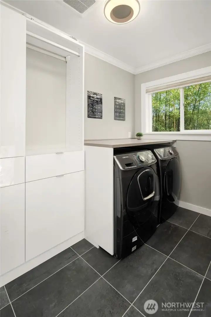 Dedicated laundry room with storage, located on upper floor with primary and 2 bedrooms Dedicated laundry room with storage, located on upper floor with primary and 2 bedrooms