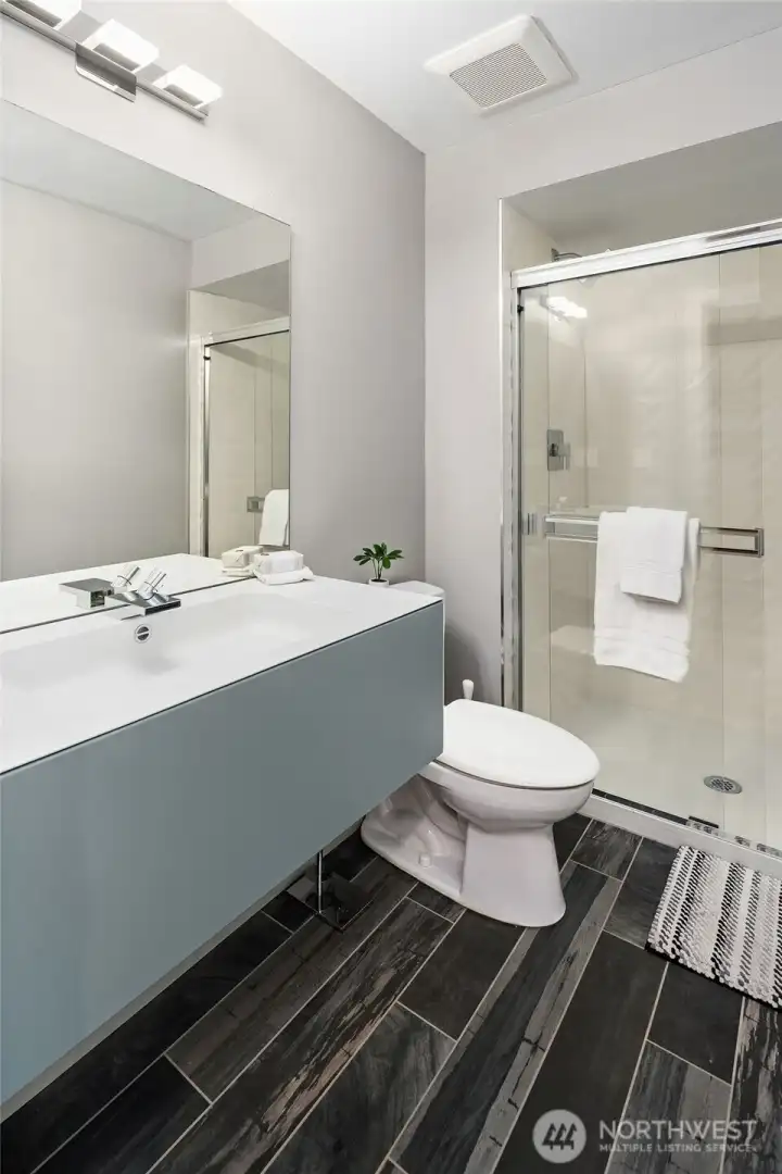 This 3/4 bath located on the lower level is perfect for guests This 3/4 bath located on the lower level is perfect for guests