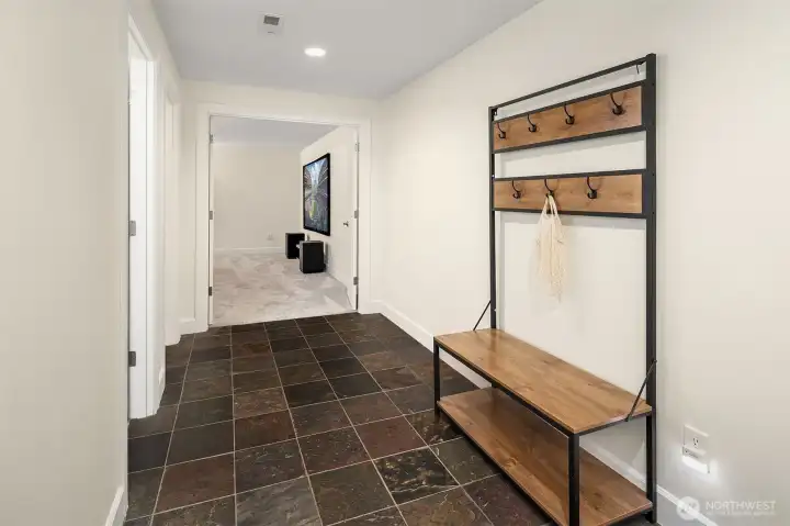 Hallway on lower level gives access to garage, media room, 3/4 bath, and 2 additional storage closets Hallway on lower level gives access to garage, media room, 3/4 bath, and 2 additional storage closets