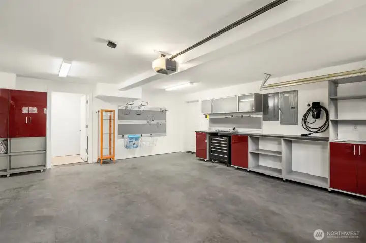 2-car garage with built in work benches and EV charging 2-car garage with built in work benches and EV charging