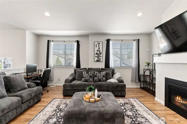 Comfortable living room with vaulted ceilings and gas fireplace. Comfortable living room with vaulted ceilings and gas fireplace.