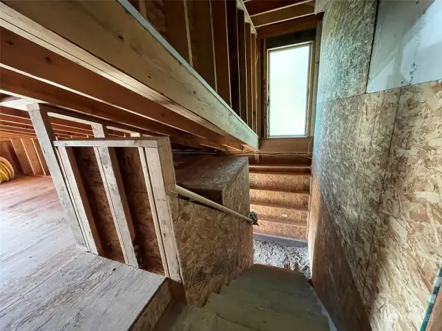 Stairs leading down from second floor of the barn.