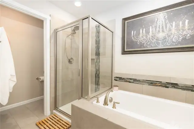 Primary bath with tiled soaker tub and separate shower