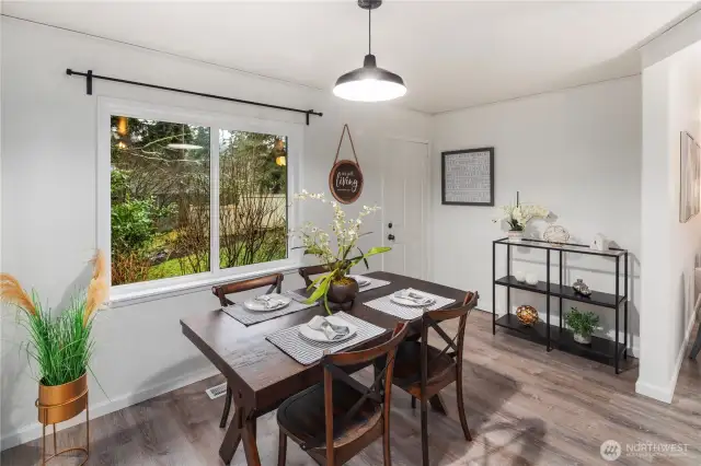 Plenty of natural light enters from two large windows into the dining area.