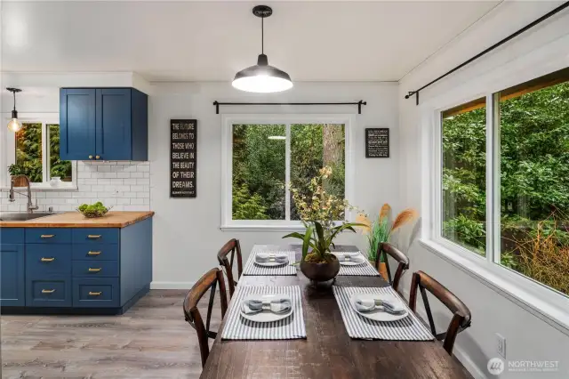 Plenty of natural light enters from two large windows into the dining area.