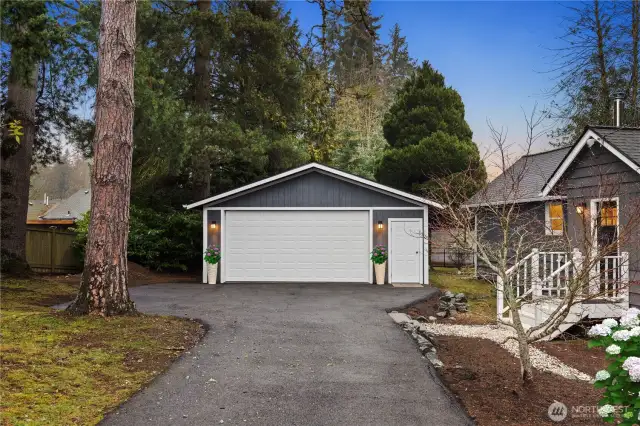 The clean and spacious oversized garage can also be used for a shop space if you so desire! NB. The hydrangea bush has been digitally enhanced.