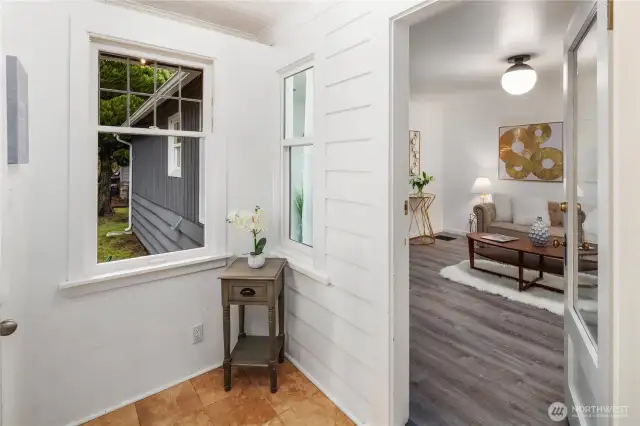 Enter into the vestibule/mudroom before you enter the home. If you turned right here, you would see the stairs going to the lower level.