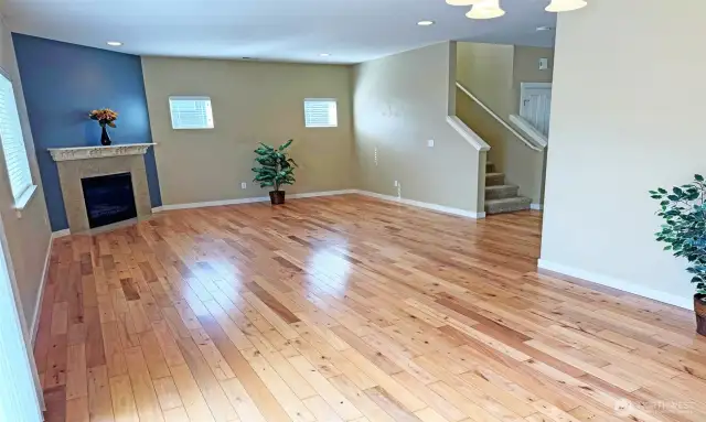 Living Room with dual windows & gas fireplace