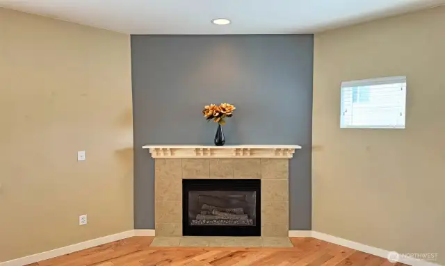 Elegant gas fireplace with mantel and tile surrounded