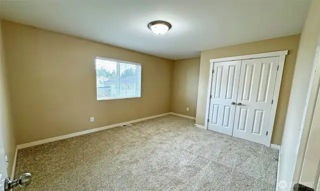 2nd bedroom with French door closets