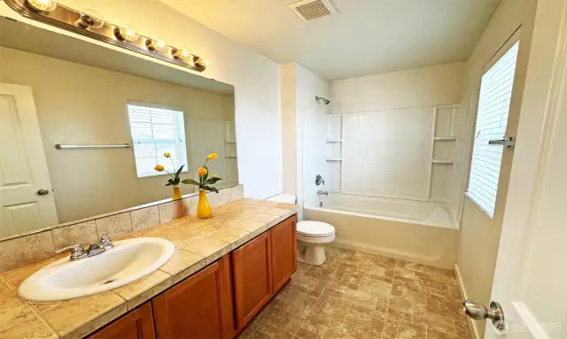 Guest bathroom with tile countertops