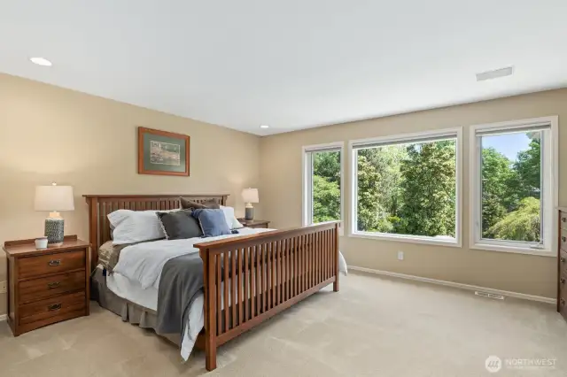 Generous Primary Bedroom Overlooking Peaceful Backyard