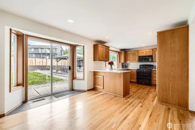 CASUAL DINING AREA WITH WONDERFUL HARWOOD FLOORS AND ACCESS TO LARGE BACKYARD.