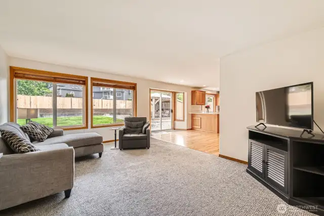 COMFORTABLE AND OPEN FAMILY ROOM WITH EASY ACCESS TO BACK DECK AND KITCHEN.