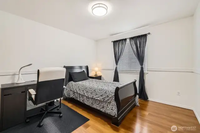COMFORTABLE SECOND BEDROOM IS ATTRACTIVE AND BRIGHT.