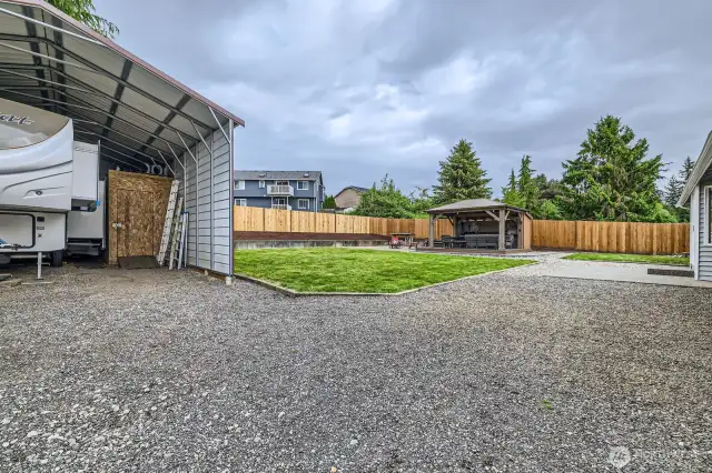 DEDICATED PARKING FOR THIS HOME IS IMPRESSIVE: DOUBLE RV SPACE OR BOAT PARKING, SECURE GATE.