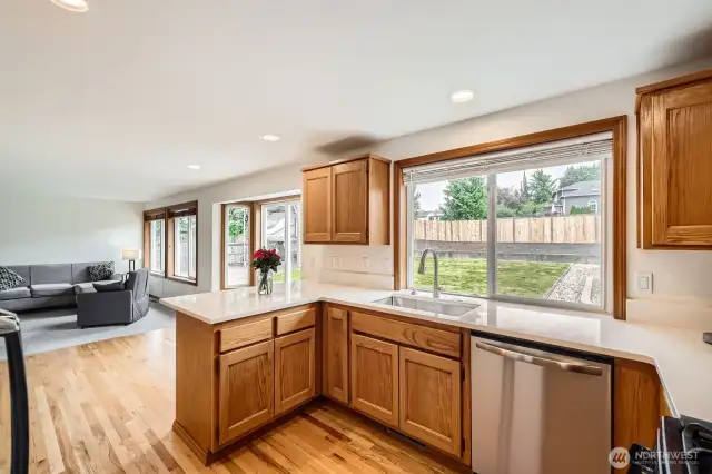 KITCHEN IS ATTRACTIVE AND FUNCTIONAL, SLIDING DOOR LEADS TO ENTERTAINMENT GAZEBO.