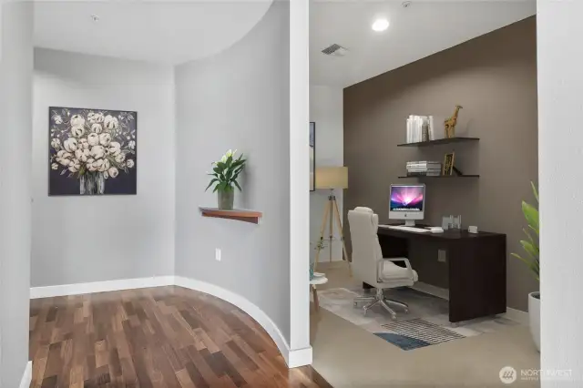Entry with new hardwood floors and entry to den
