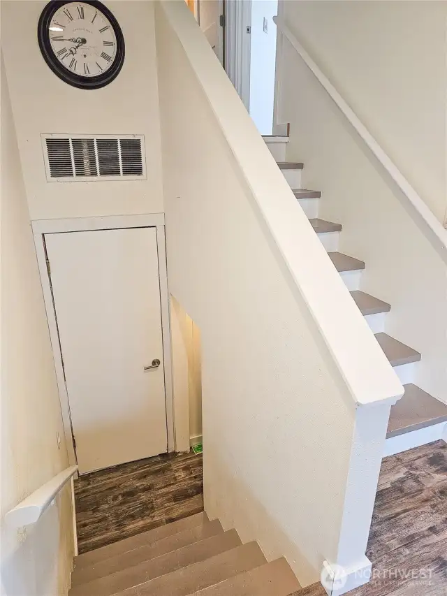 Storage at stairs and in second bedroom.