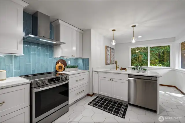 The completely remodeled kitchen features an eat in nook, perfect for a banquette table.