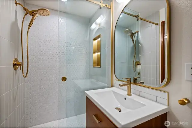 Relax in a luxurious shower complete with a light up niche.
