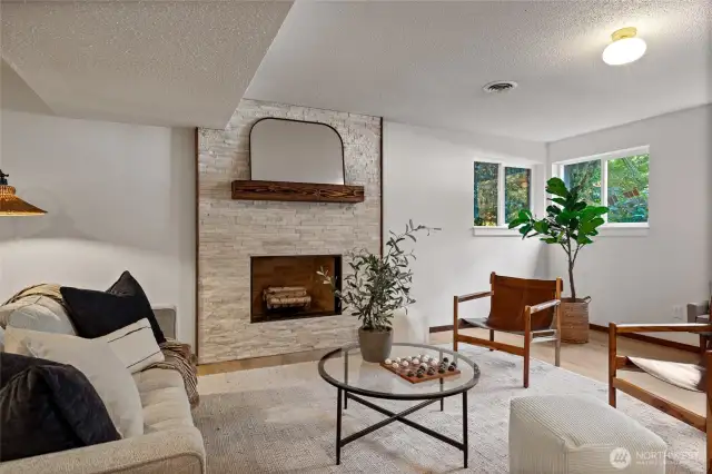 The large second living space includes a second FP, new LVP and stone ledger FP.