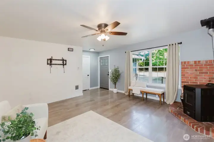 Light filled living room with cozy pellet stove