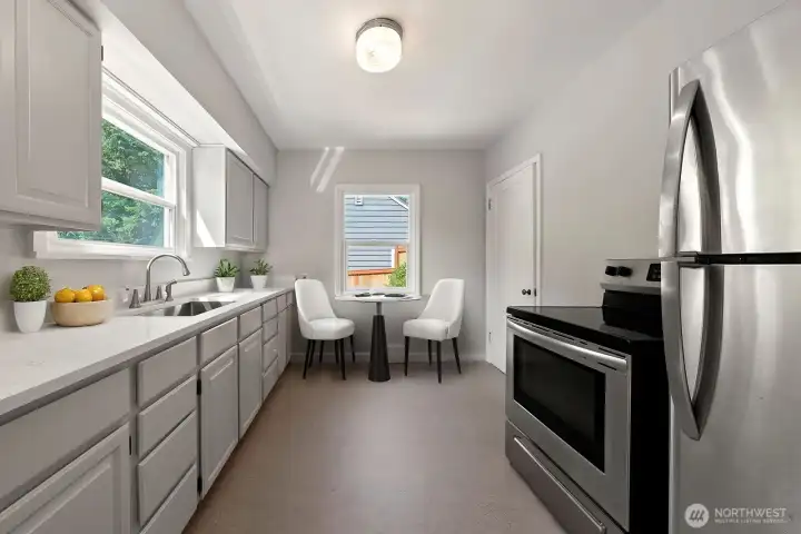 Create delicious meals and fun conversations in this updated kitchen! Enjoy the following new additions; beautiful quartz countertop, deep, stainless sink with satin finish faucet fixture, lighting over the sink and flooring.