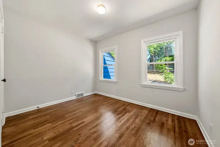 Bedroom 2   presently shown as vacant  Benjamin Moore & Sherwin Williams high quality paint  Double pane windows throughout the house.