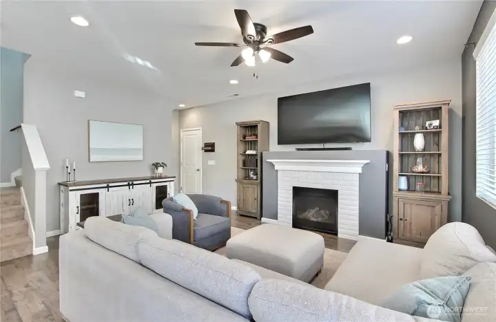As you enter, you will find your open concept family room and kitchen, door to garage is to left of fireplace, closet is there as well.