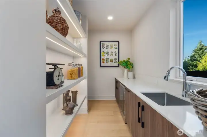 Italian-style prep kitchen with wine cooler and space for an extra fridge/freezer, everything today's chef desire.