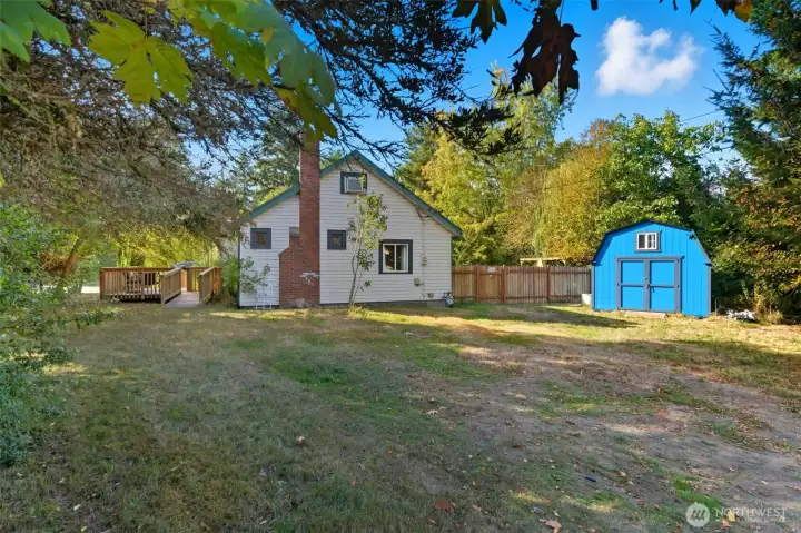 Side yard is great for parking and bonus shed for storage!
