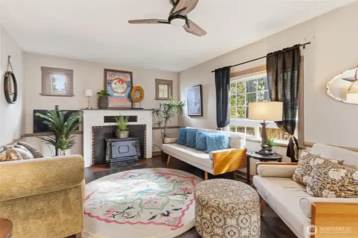 Light and bright living room with wood burning fireplace