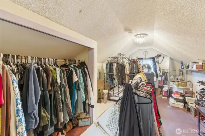 Other end of upper level bedroom with closet