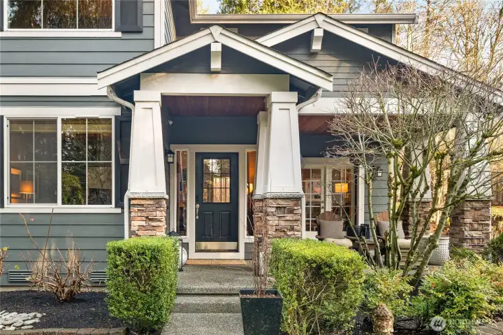 Entry with peaceful covered porch