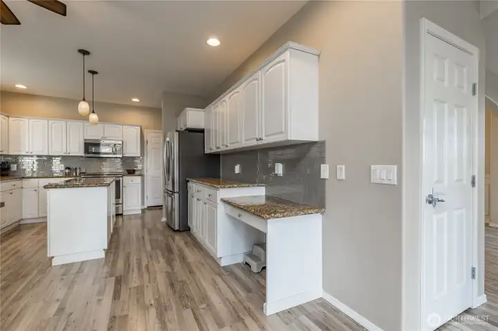 Extensive counter space and cabinetry, plus a walk-in pantry!