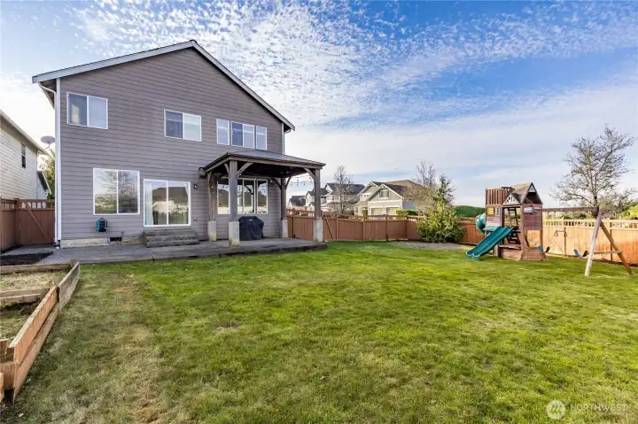 Large level yard offers a great space to play or relax, or venture into the very walkable neighborhood to enjoy community play areas!