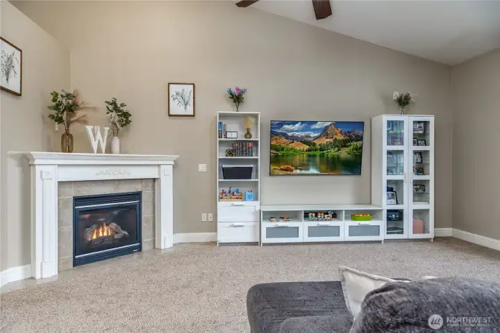 Vaulted ceiling and a gorgeous corner gas fireplace